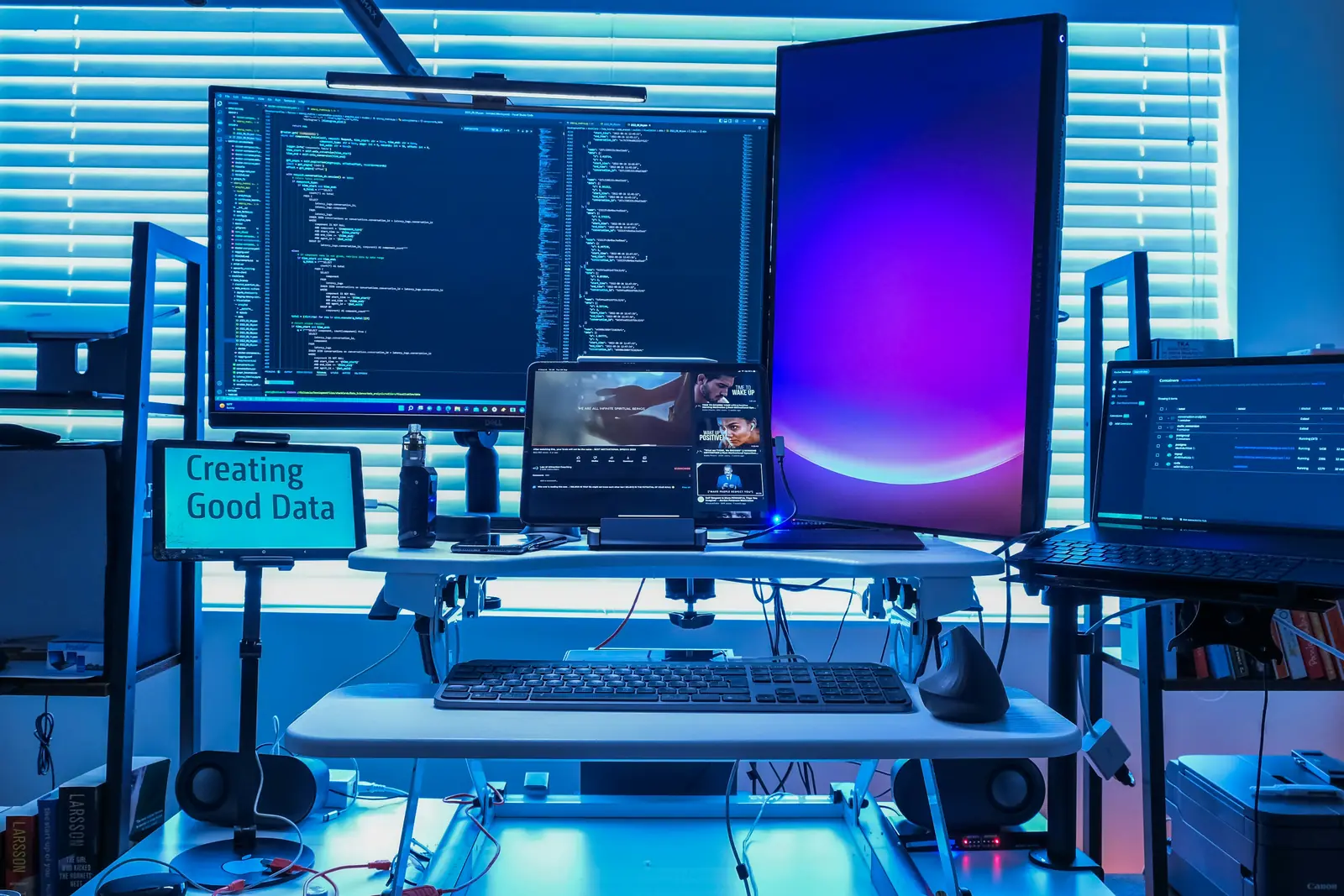 A multi-monitor Mac desk used for repeatable screenshot work