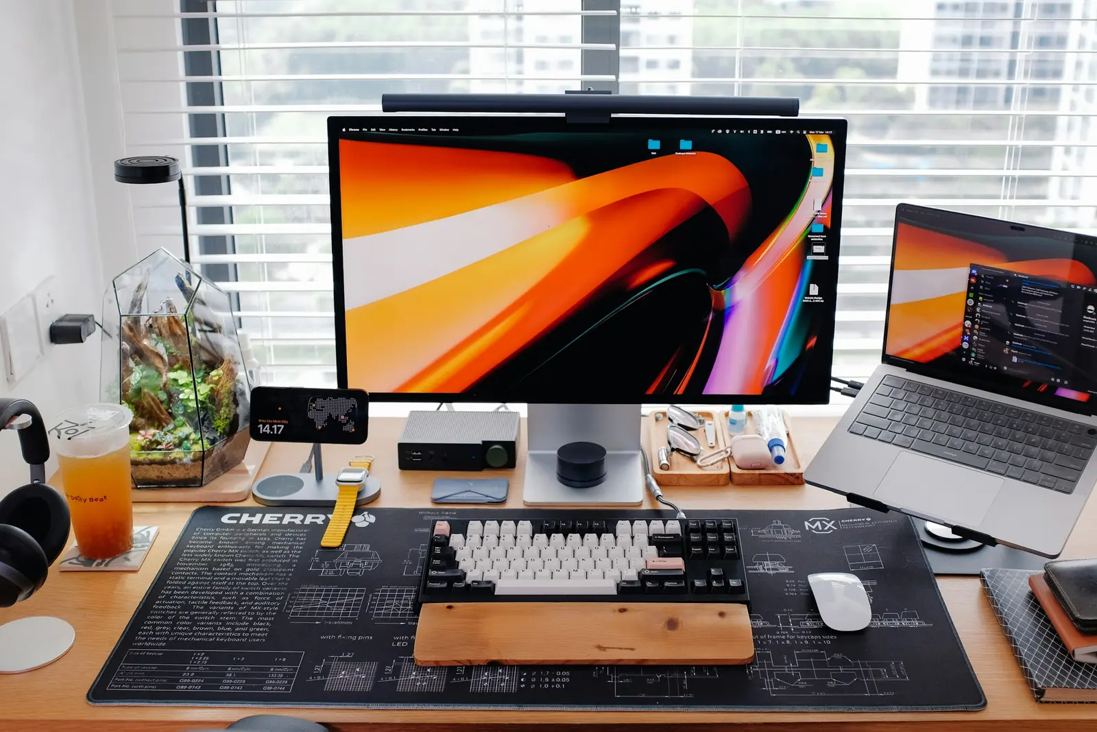 Multiple screens on a desk for a website screenshot review workflow