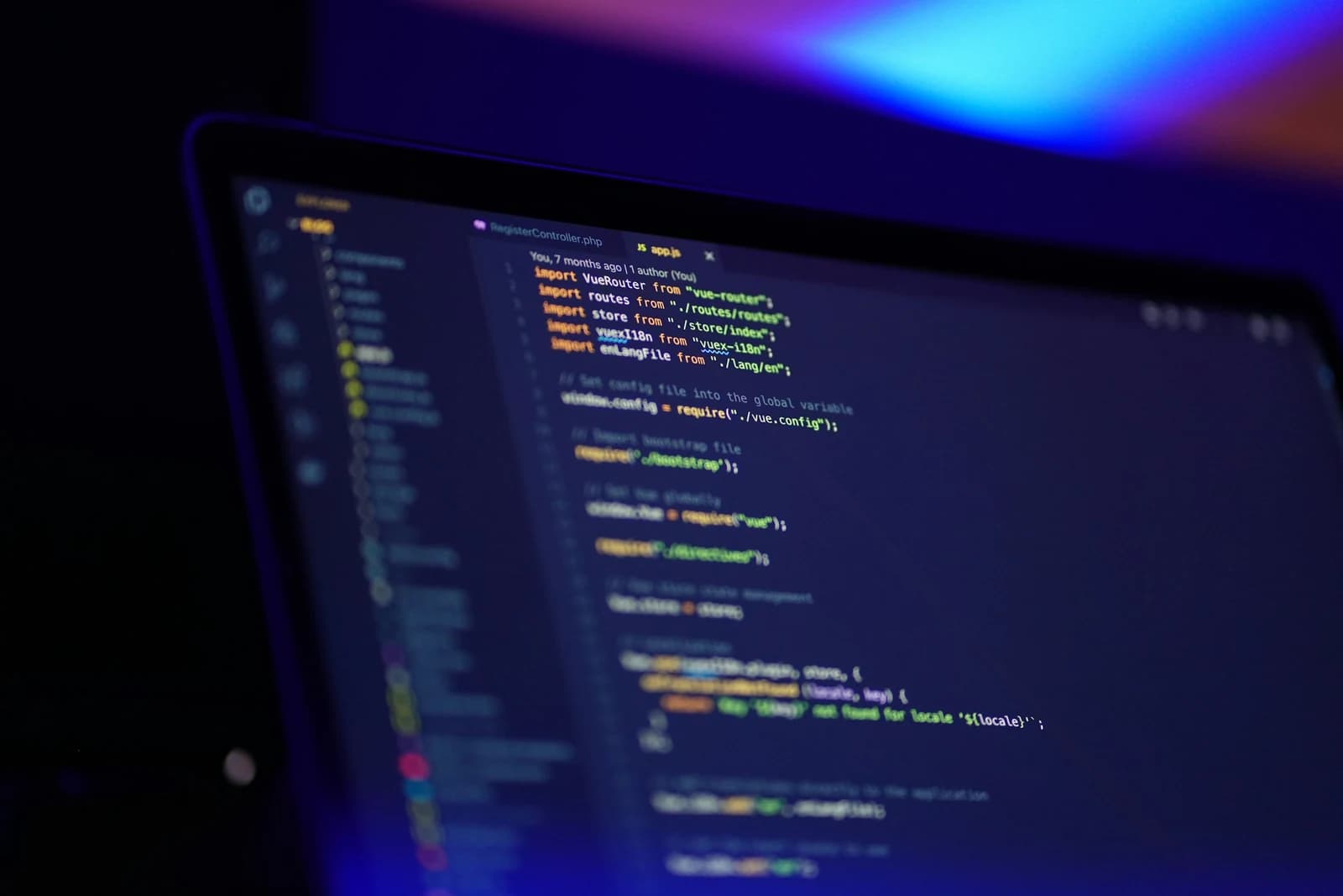 Laptop showing code for a Puppeteer website screenshot script